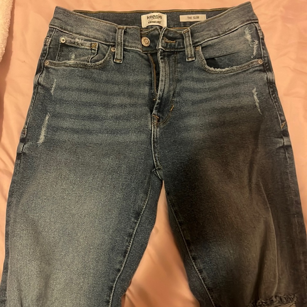 mom jeans with ripped design at bottom